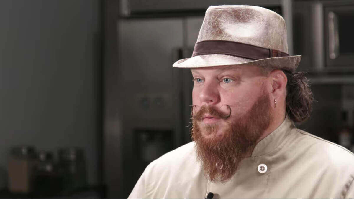 Executive Chef Tim Condon of Angry Cactus restaurant looking at a camera